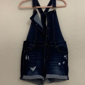 Denim overalls.